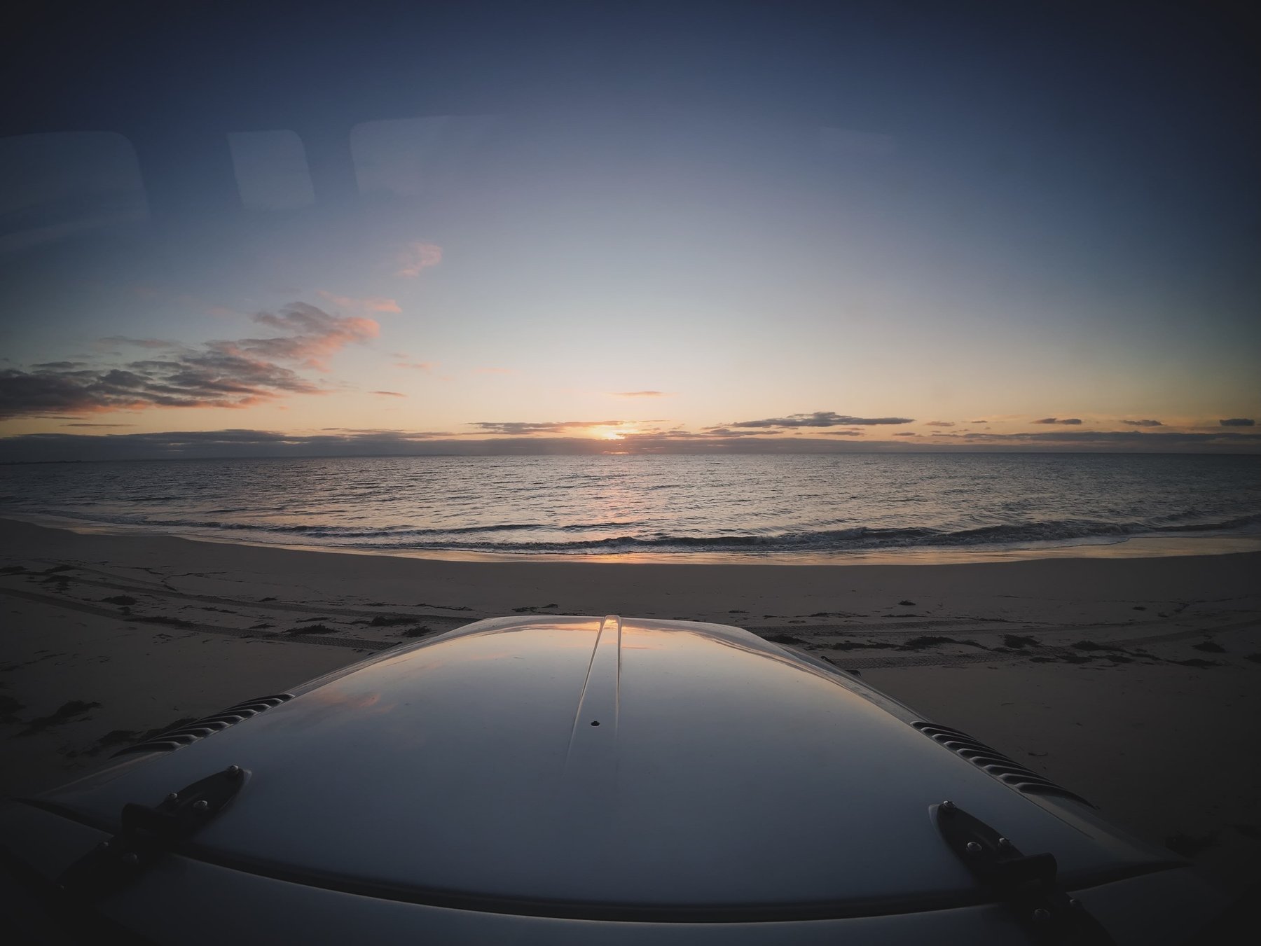 Sunset over the ocean from the HJ47 bonnet
