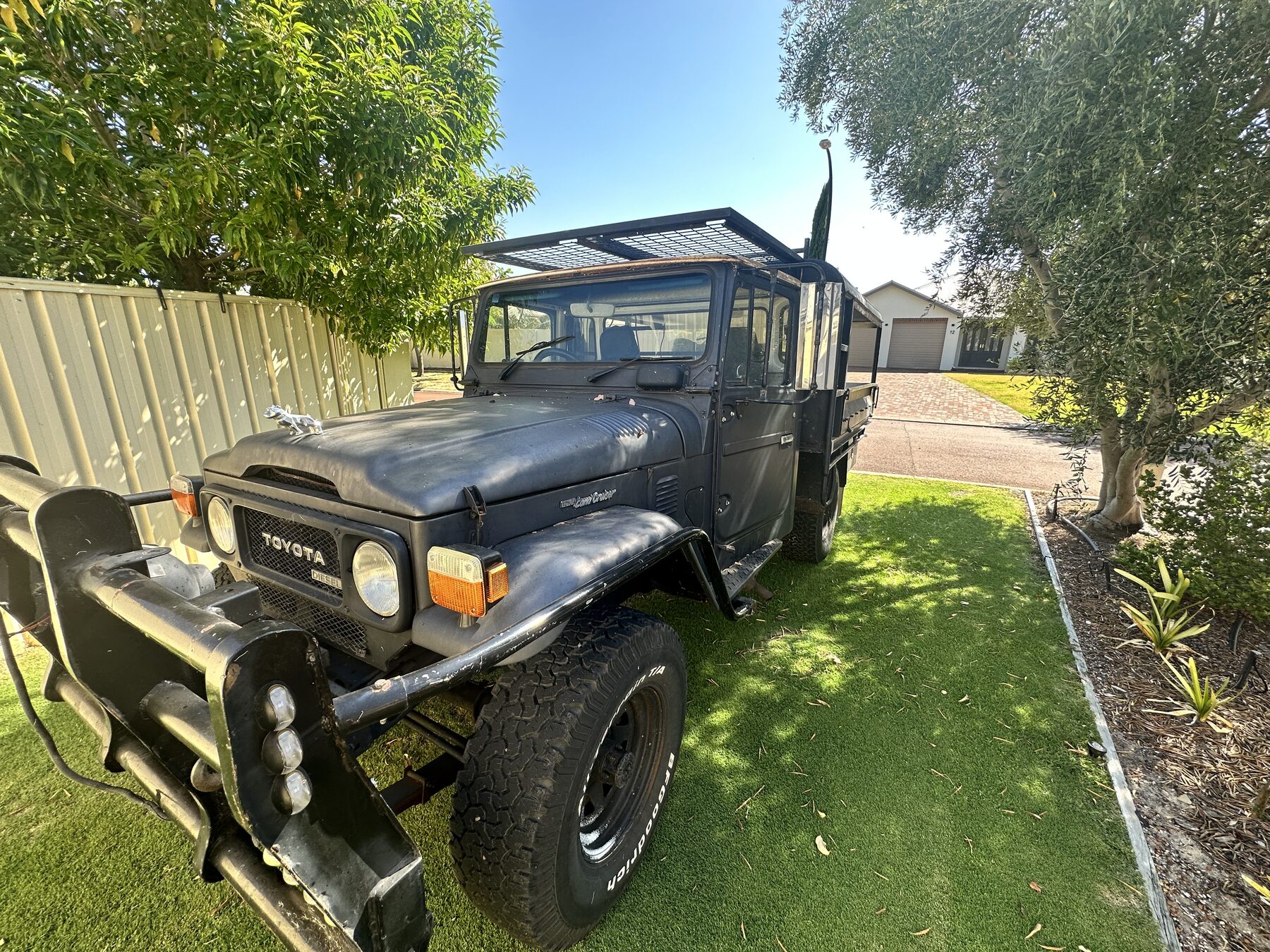 The HJ47 as found in Bridgetown — matte black with roof rack, bullbar and spotlights